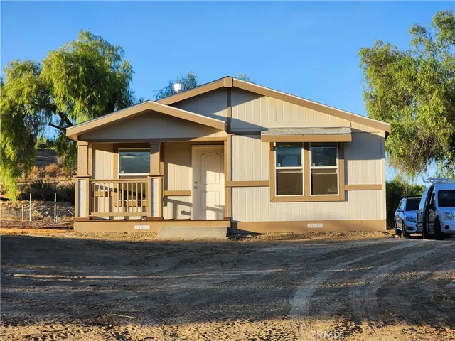 a front view of a house with a porch