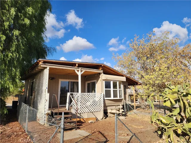 a view of an empty room and a fireplace