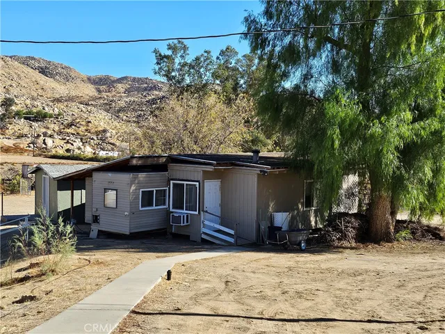 a view of a street with a building in the background