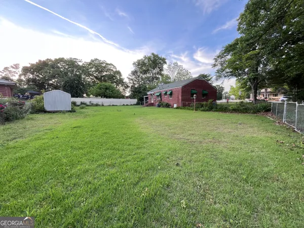 a view of a house with a back yard