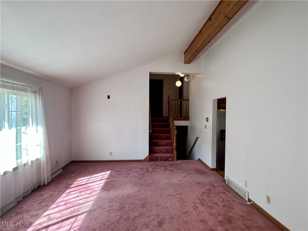 399 Abbyshire Road Green, OH 44319 - Photo 15 of 48 Walk up second floor living room with vaulted ceiling with beam and large bright picture window