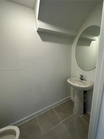 a view of staircase with white walls