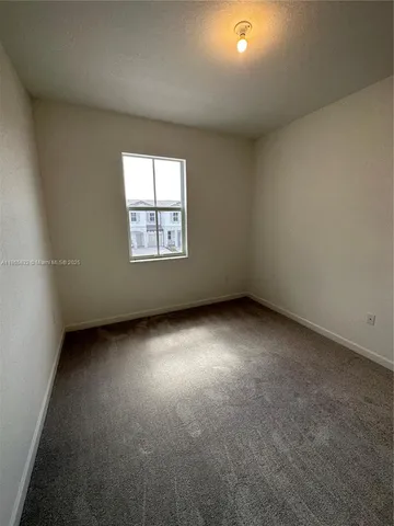 a view of a room with a window