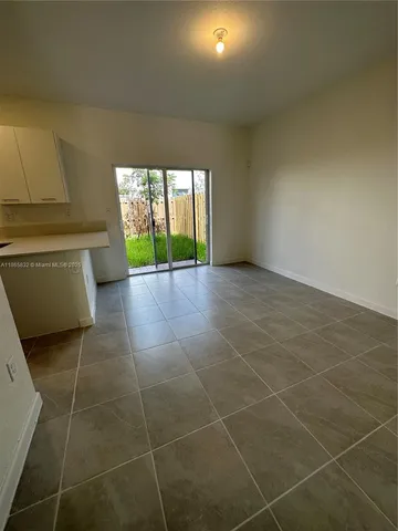 a bathroom with a large tub and shower