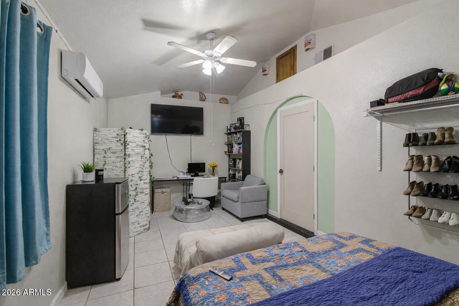 3107 West Montebello Avenue Phoenix, AZ 85017 - Photo 21 of 30 a living room with furniture and a flat screen tv