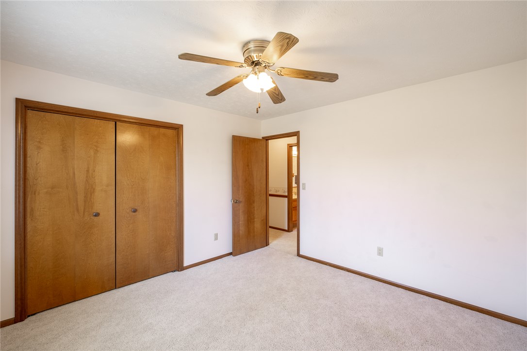 276 South Fairfield Road Bellbrook, OH 45305 - Photo 27 of 38 This spacious bedroom features ample closet space and a ceiling fan, offering comfort and convenience.