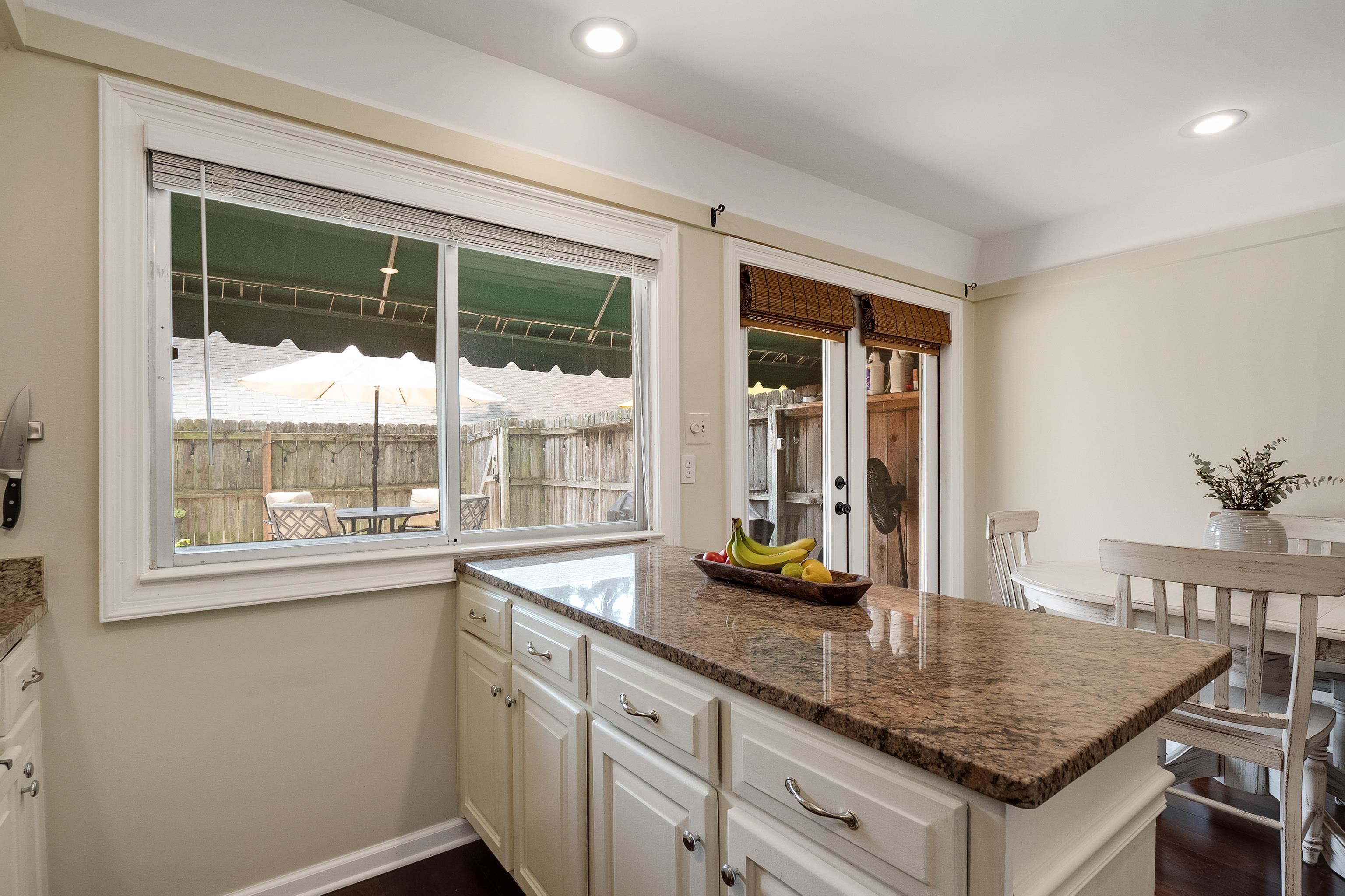 1237 Chamberlain Drive, Unit 1237 Memphis, TN 38119 - Photo 14 of 25 a kitchen with granite countertop a sink and a window