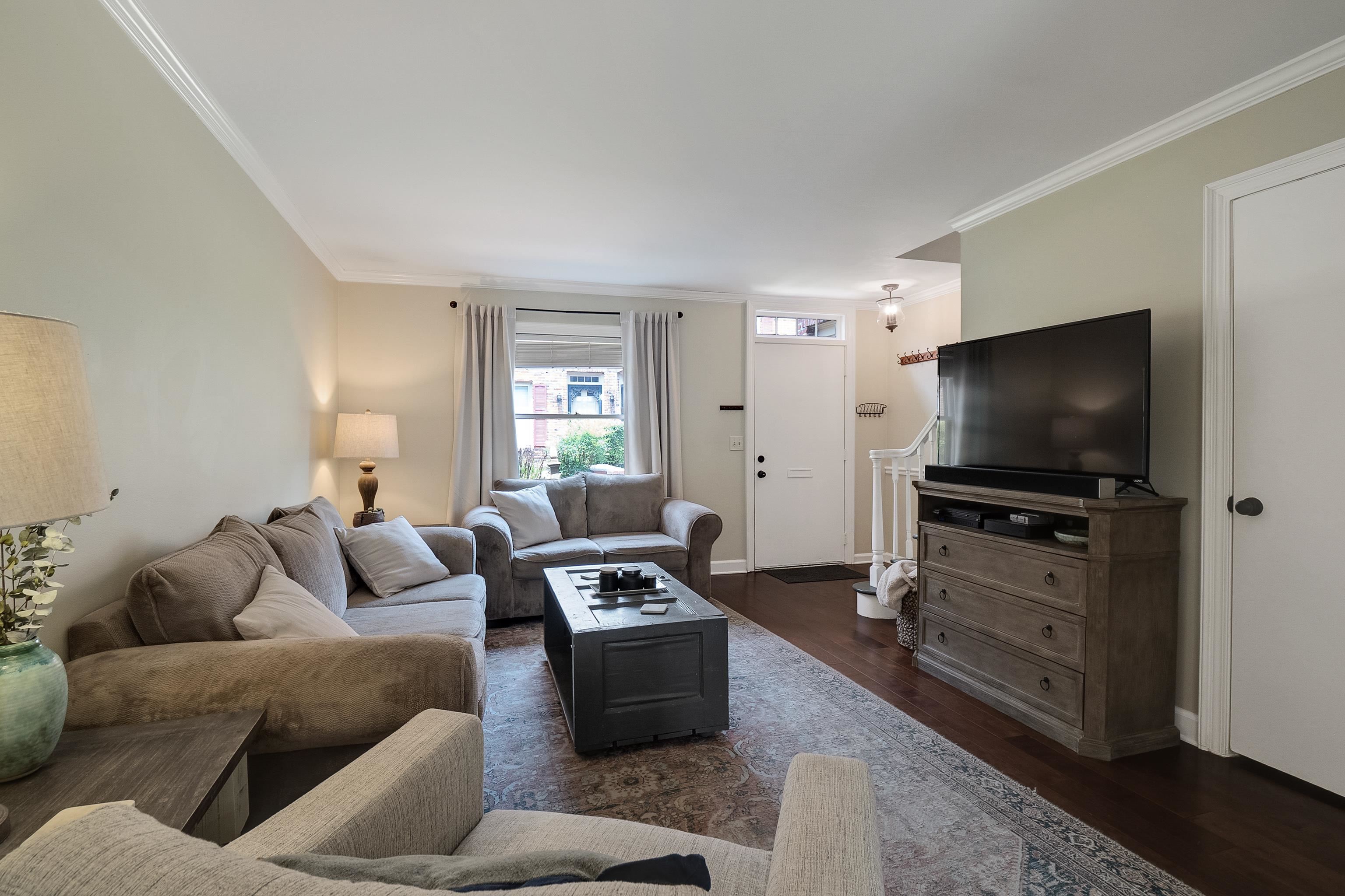 1237 Chamberlain Drive, Unit 1237 Memphis, TN 38119 - Photo 7 of 25 a living room with furniture and a flat screen tv