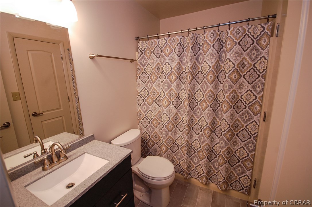 54 D Villa Ridge Drive, Unit D Hartfield, VA 23071 - Photo 14 of 34 FULL BATH WITH NEW VANITY & TILED FLOOR