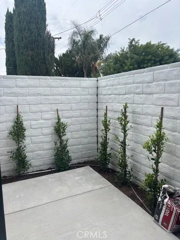 a view of a backyard with sitting area