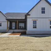 a house with trees in the background