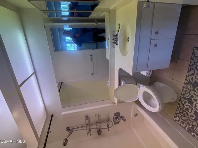 a bathroom with a toilet and a sink