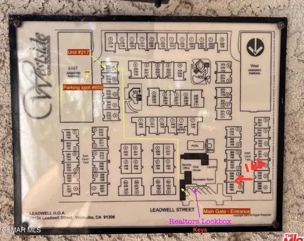 a view of a door and a street sign