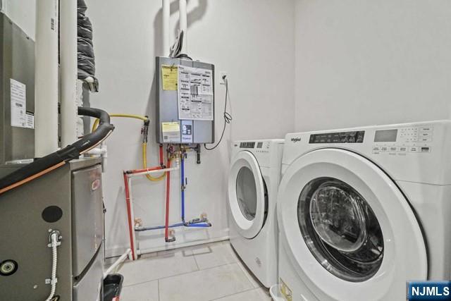 54 Arnold Drive Wood-Ridge, NJ 07075 - Photo 22 of 40 a utility room with dryer and washer