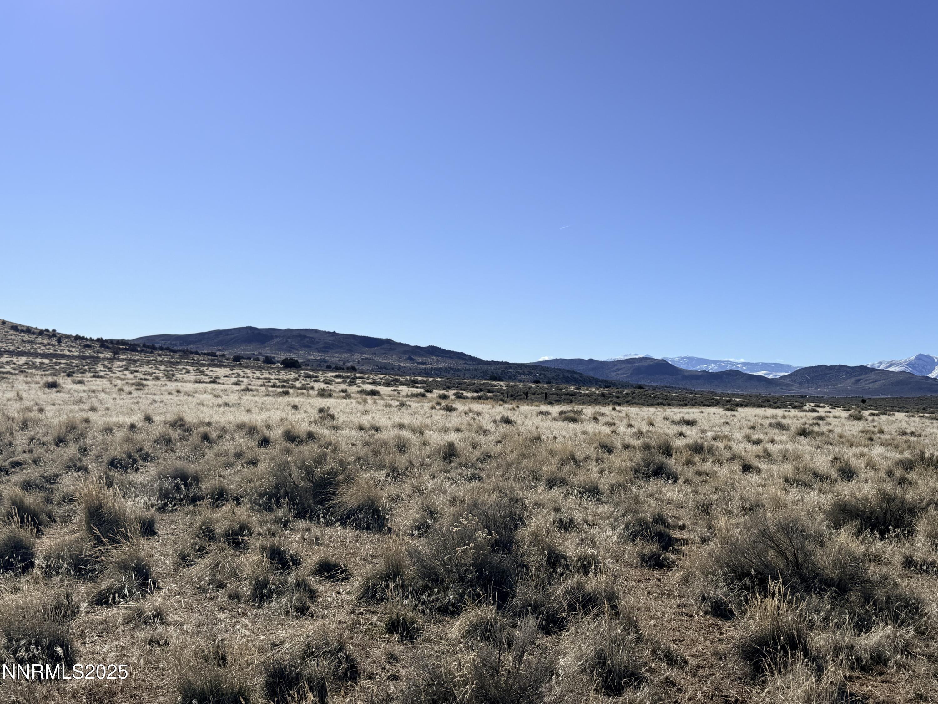 230 Prospect Hill Road Reno, NV 89506 - Photo 7 of 13 a view of a large body of water with a mountain in the background