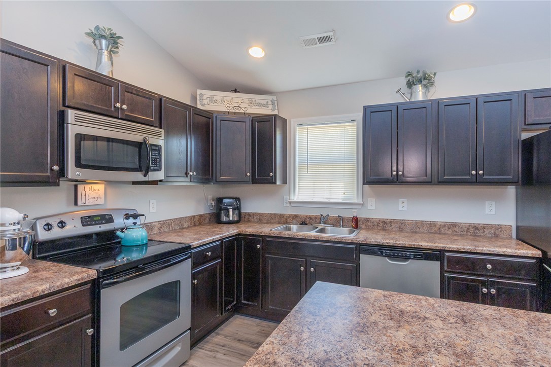 158 Mediterranean Avenue Anderson, SC 29621 - Photo 11 of 39 This spacious kitchen offers ample cabinetry, modern appliances, and a convenient layout for everyday living.