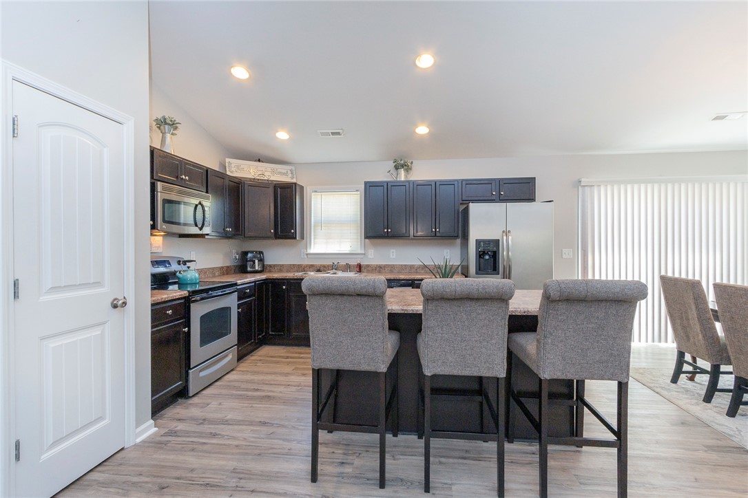 158 Mediterranean Avenue Anderson, SC 29621 - Photo 14 of 39 This spacious kitchen offers ample cabinet space and modern appliances, perfect for everyday living.