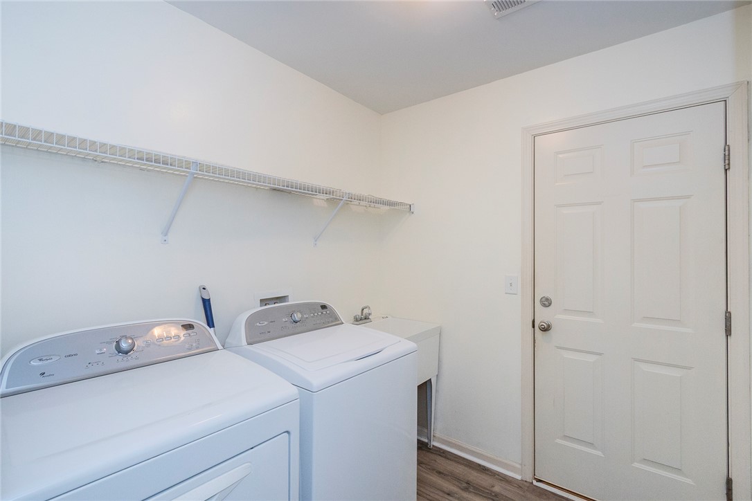 158 Mediterranean Avenue Anderson, SC 29621 - Photo 15 of 39 This functional laundry area features ample storage and modern appliances for everyday convenience.