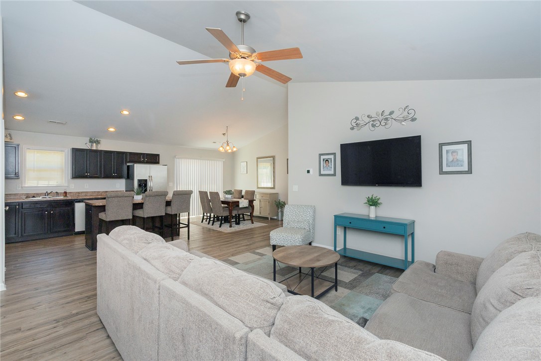 158 Mediterranean Avenue Anderson, SC 29621 - Photo 16 of 39 This bright and airy living area flows seamlessly into the kitchen and dining spaces.