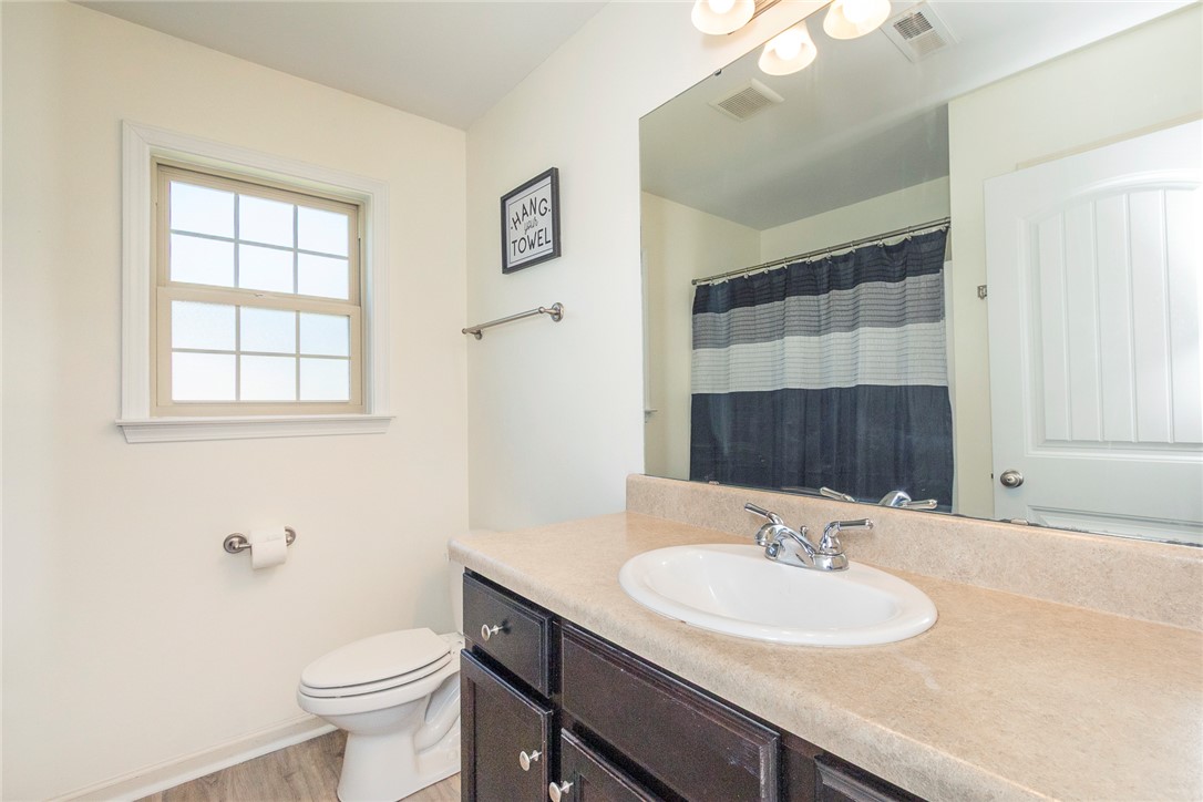 158 Mediterranean Avenue Anderson, SC 29621 - Photo 19 of 39 This bathroom features a sleek vanity and a bright window, offering a refreshing space.