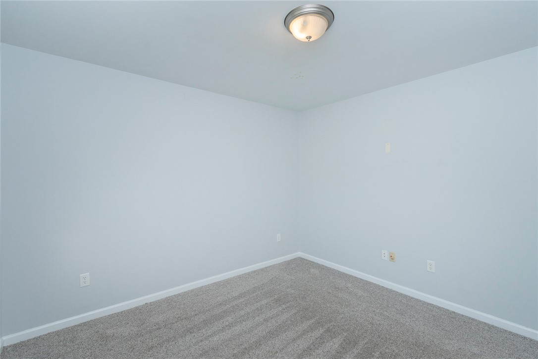 158 Mediterranean Avenue Anderson, SC 29621 - Photo 23 of 39 This spacious room features plush carpeting and a ceiling-mounted light fixture, offering a versatile living space.