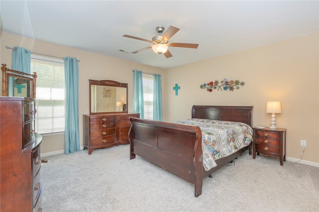158 Mediterranean Avenue Anderson, SC 29621 - Photo 24 of 39 This spacious bedroom offers ample natural light and a comfortable retreat.