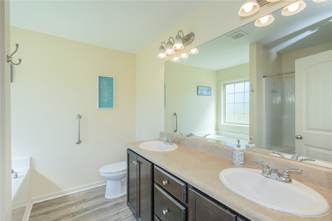 158 Mediterranean Avenue Anderson, SC 29621 - Photo 27 of 39 This spacious bathroom offers a double vanity and a tranquil ambiance for unwinding.