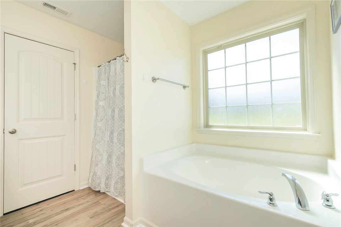 158 Mediterranean Avenue Anderson, SC 29621 - Photo 29 of 39 This serene bathroom offers a bright window and a spacious built-in tub.