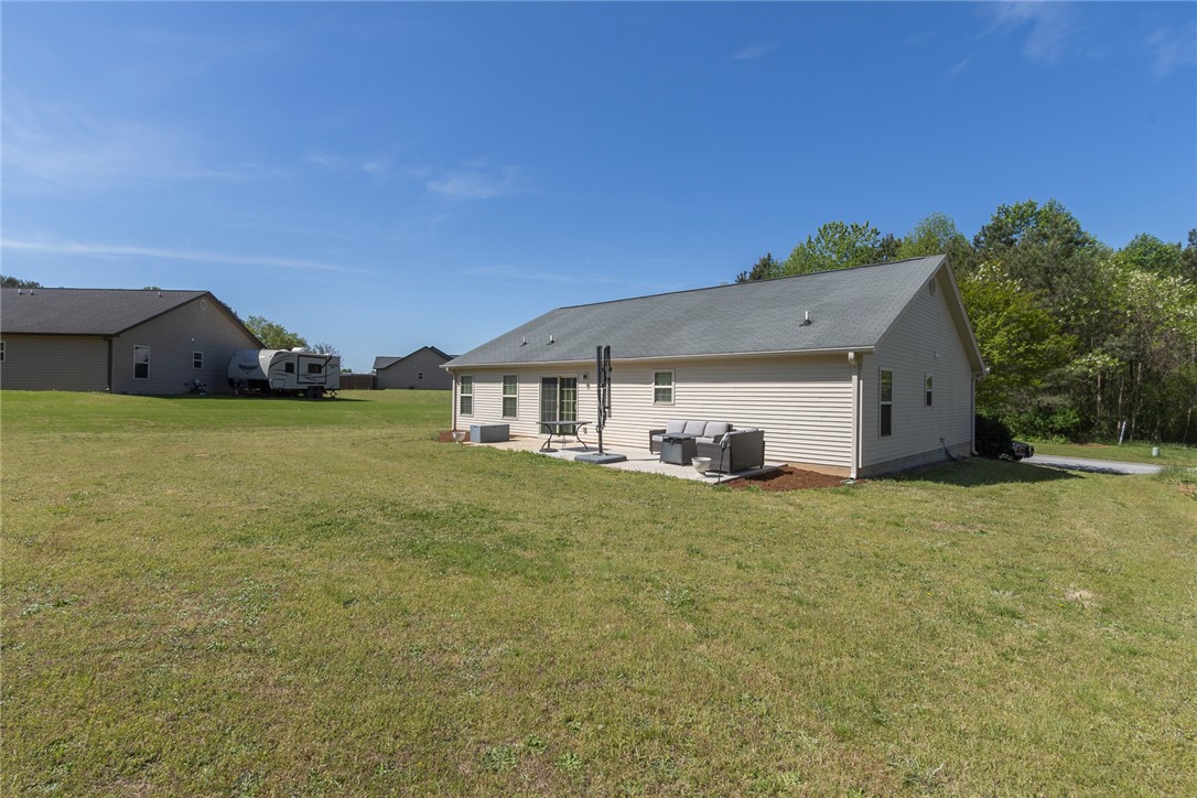 158 Mediterranean Avenue Anderson, SC 29621 - Photo 33 of 39 This outdoor patio provides a tranquil space for relaxation and enjoyment.
