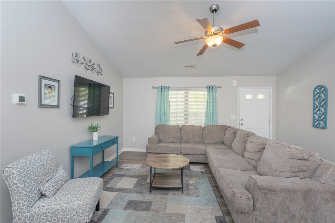 158 Mediterranean Avenue Anderson, SC 29621 - Photo 5 of 39 This inviting living space features high ceilings and durable flooring, ideal for comfortable daily living.