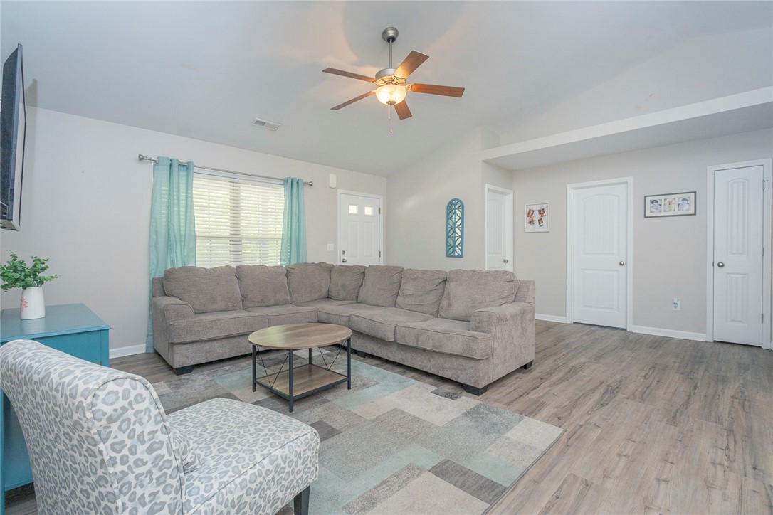 158 Mediterranean Avenue Anderson, SC 29621 - Photo 6 of 39 This bright living space features durable flooring and a refreshing ceiling fan.