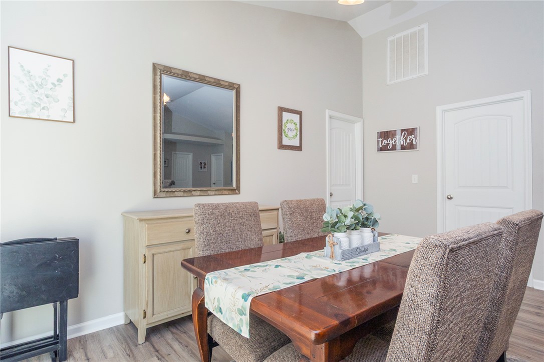 158 Mediterranean Avenue Anderson, SC 29621 - Photo 9 of 39 This inviting dining area features vaulted ceilings, wood flooring, and ample natural light for memorable gatherings.