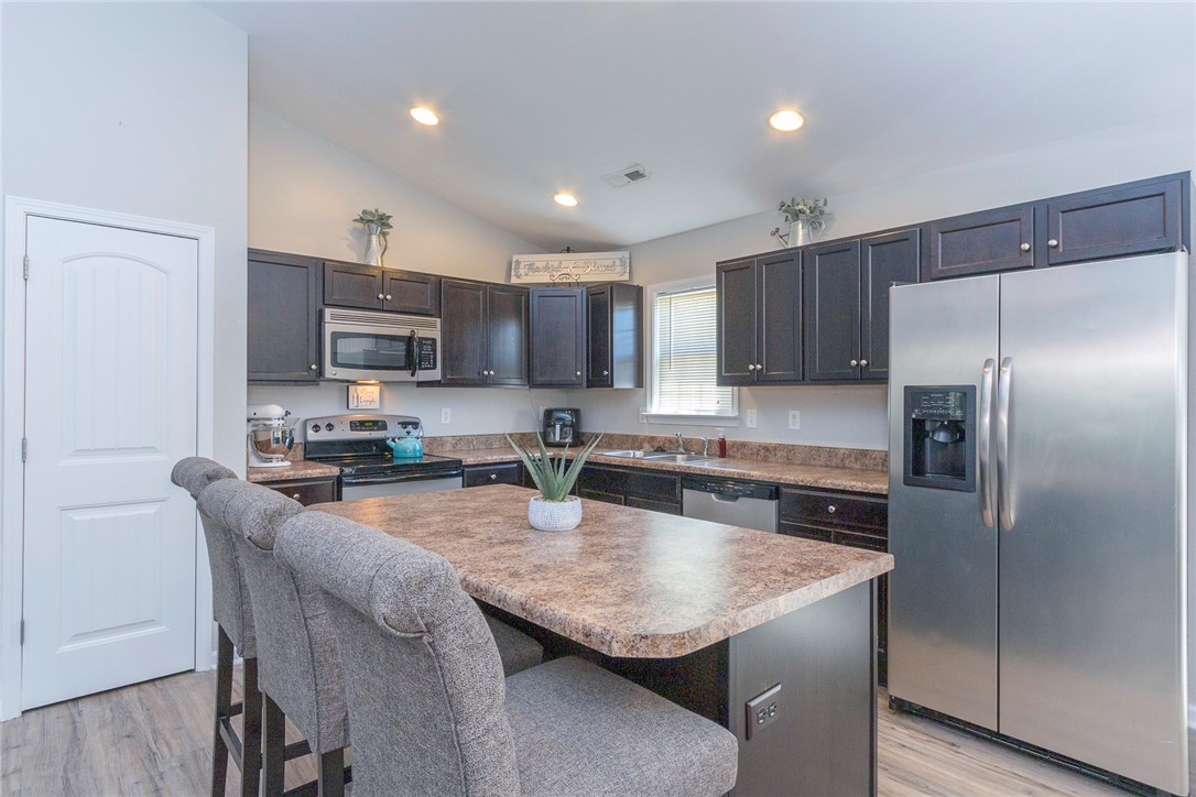158 Mediterranean Avenue Anderson, SC 29621 - Photo 10 of 39 This spacious kitchen offers ample cabinet storage and convenient breakfast bar seating.