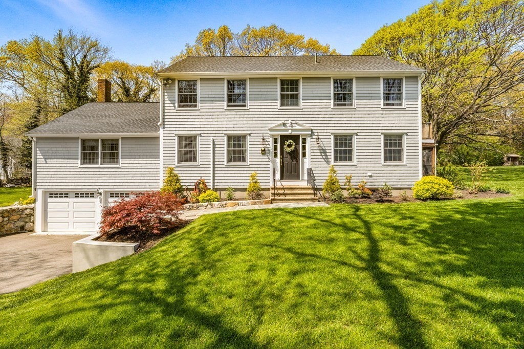 140 Gannett Road Scituate, MA 02066 - Photo 32 of 36 a front view of a house with a yard