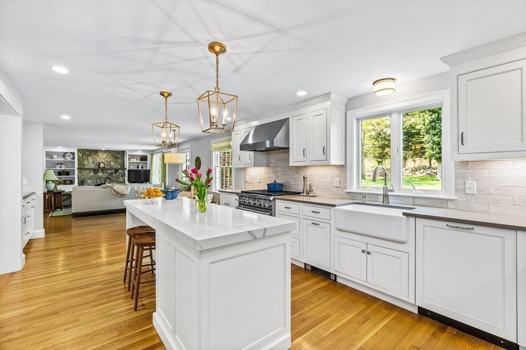 140 Gannett Road Scituate, MA 02066 - Photo 5 of 36 a kitchen with stainless steel appliances granite countertop a sink stove and refrigerator