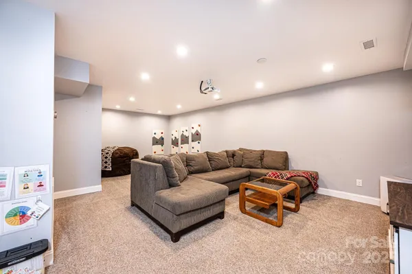 a bedroom with a bed a table and chair