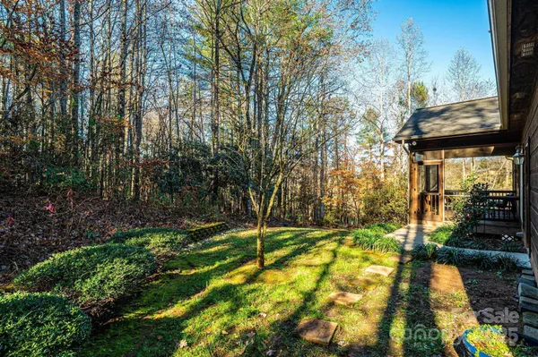 a open kitchen with stainless steel appliances kitchen island granite countertop a stove a refrigerator a dining table and chairs with wooden floor