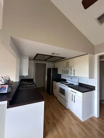 a kitchen that has a sink and a stove