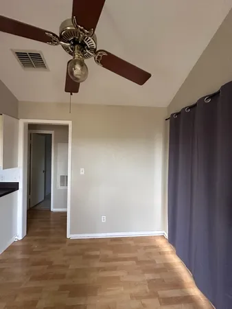 a kitchen with stainless steel appliances granite countertop a sink a stove and refrigerator