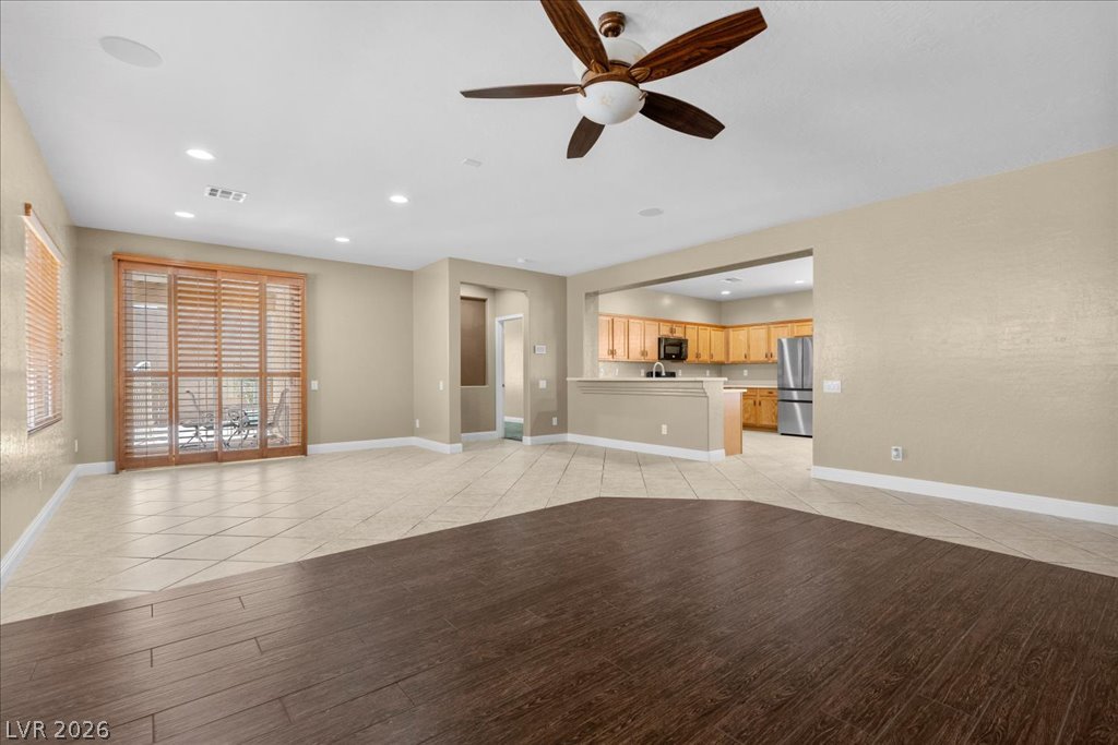 2627 Dirleton Place Henderson, NV 89044 - Photo 13 of 42 The heart of the home! This open-concept living space flows effortlessly from the kitchen, making entertaining easy.