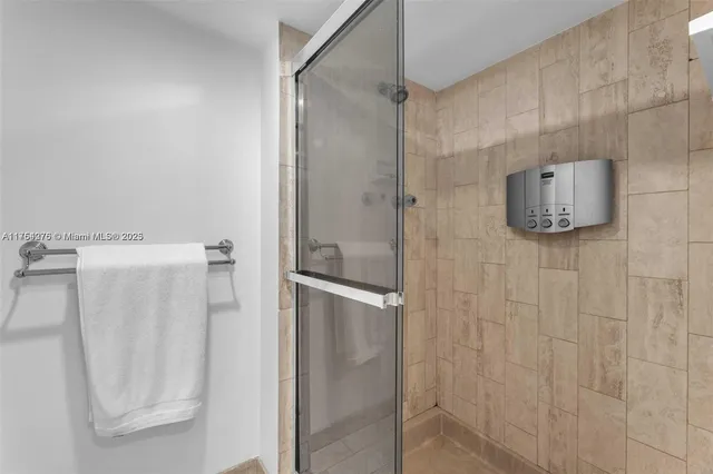 a bedroom with a bed and a table in it