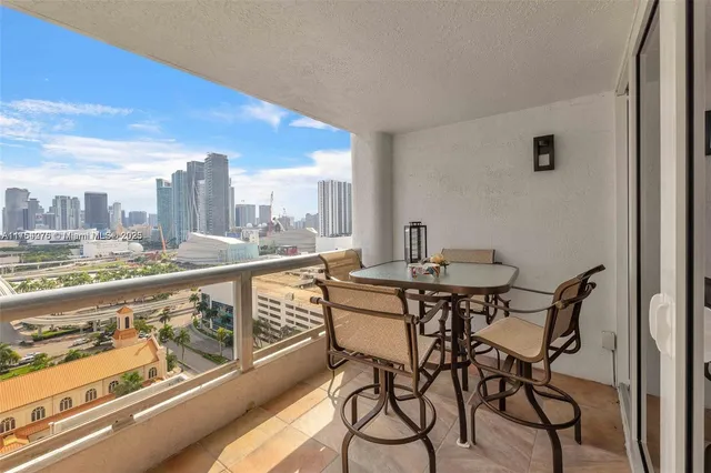 a view of balcony with wooden floor