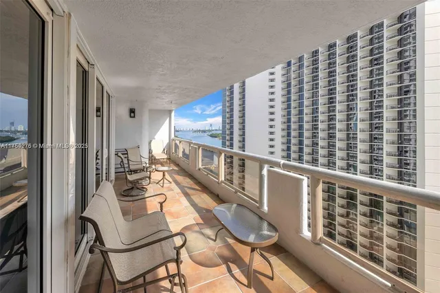 a view of balcony with furniture