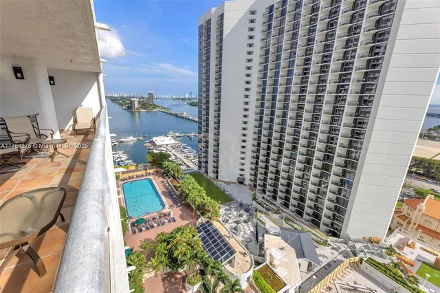 a bathroom with a double vanity sink toilet and shower