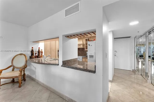 a view of a livingroom with furniture and front door