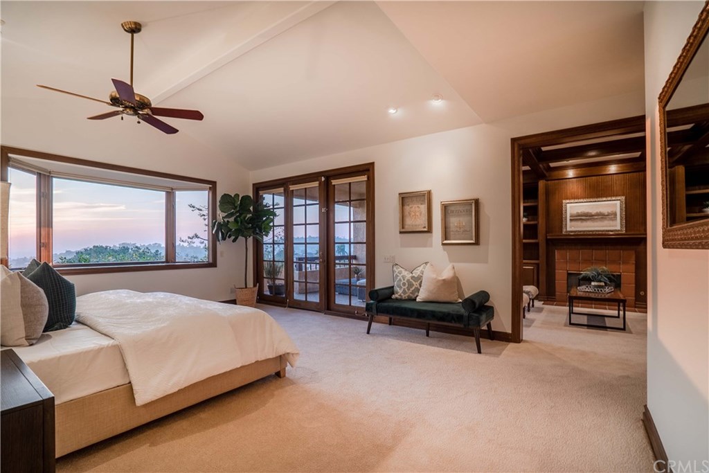10521 Easter Hill Drive North Tustin, CA 92705 - Photo 12 of 31 Expansive master bedroom with views and separate library/sitting area with fireplace. Both the Master and sitting area have french doors with access to the covered view patio. Large Closet with built-in drawers and and custom built in walled cabinets for additional storage.