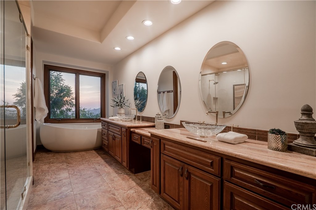 10521 Easter Hill Drive North Tustin, CA 92705 - Photo 15 of 31 Master bathroom with large soaking tub and glass shower, has direct access to dressing area and large walk-in closet.