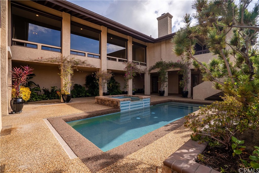 10521 Easter Hill Drive North Tustin, CA 92705 - Photo 17 of 31 Pool area, with Great Room windows above. Additional yard area is adjacent to downstairs family room. Covered spaces are great for shade from pool and/or future built-in BBQ area/tv area.