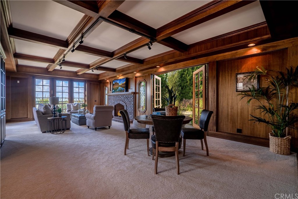 10521 Easter Hill Drive North Tustin, CA 92705 - Photo 19 of 31 Rendering of downstairs family room with french doors out to the side garden area. You could even add bifold or sliding doors that open all the way up across this wall.