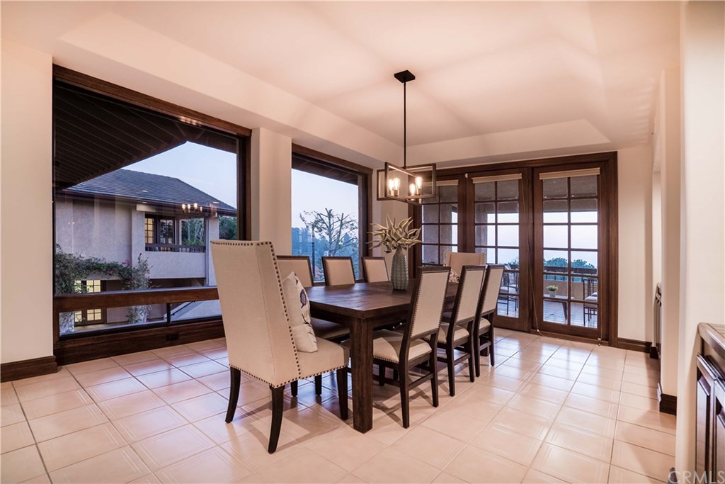 10521 Easter Hill Drive North Tustin, CA 92705 - Photo 8 of 31 Large formal dining room with built-in on the right side of photo. French doors lead to a large Terrace for extended or for more intimate outdoor dining. Guests will enjoy the beautiful Sunsets and City Lights.
eating area for Grand Entertaining.